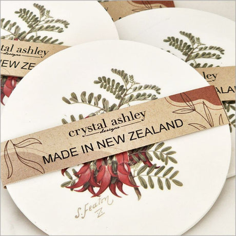 Acrylic coaster featuring Sarah Featon's watercolor Kakabeak illustration, 10cm diameter with cork backing.