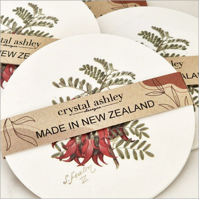 Acrylic coaster featuring Sarah Featon's watercolor Kakabeak illustration, 10cm diameter with cork backing.