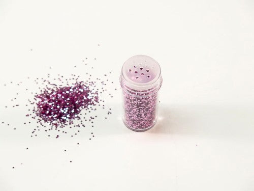 Lavender glitter in a 10gm package, perfect for adding shimmer to crafts like scrapbooking and DIY decorations.