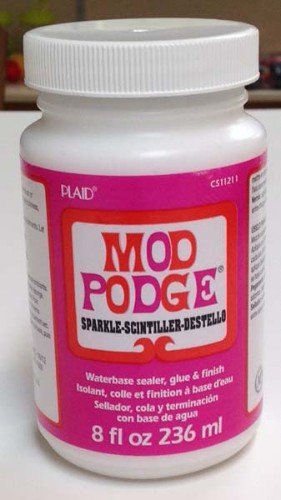 Sparkle Mod Podge 8oz: Shimmery decoupage medium for versatile crafting on wood, fabric, and paper.