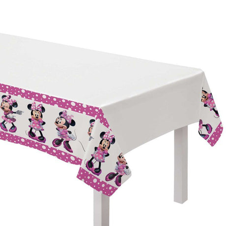Vibrant Minnie Mouse tablecover (137cm x 243cm) perfect for Disney-themed parties and easy to clean up afterward.