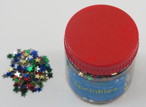 Vibrant star-shaped sprinkles in assorted colors, perfect for decorating cakes and desserts for any celebration.