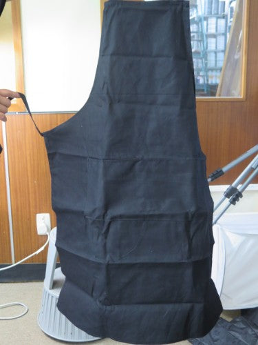 Durable charcoal apron for artists with spacious pocket, designed for creative mess protection and comfort.