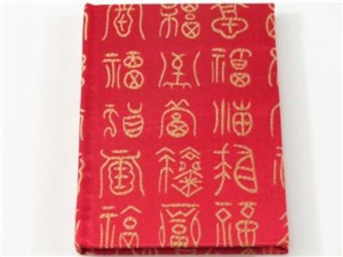 Luxurious red silk A6 notepad with gold embroidery, ideal for elegant writing and sketching.
