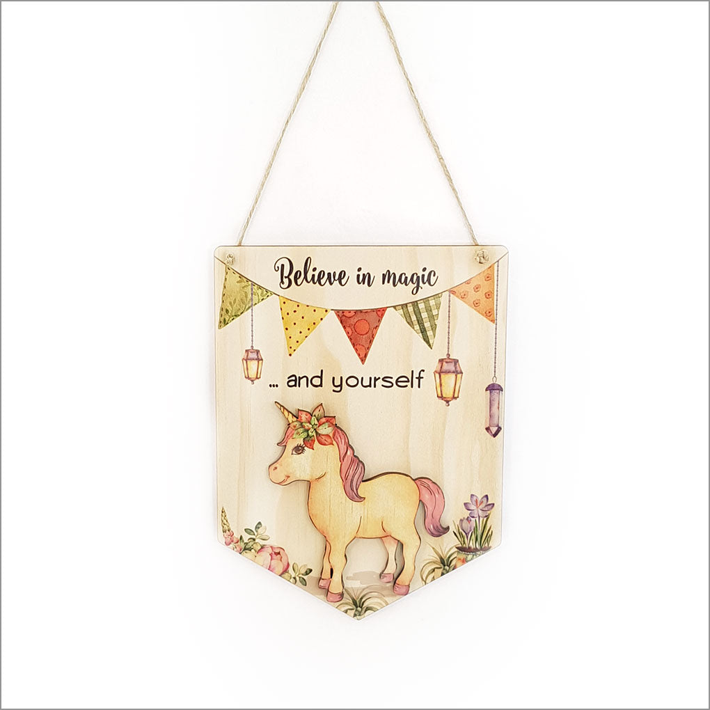 Inspiring printed pine flag featuring the message 'Believe in Magic and Yourself' for positive home decor.