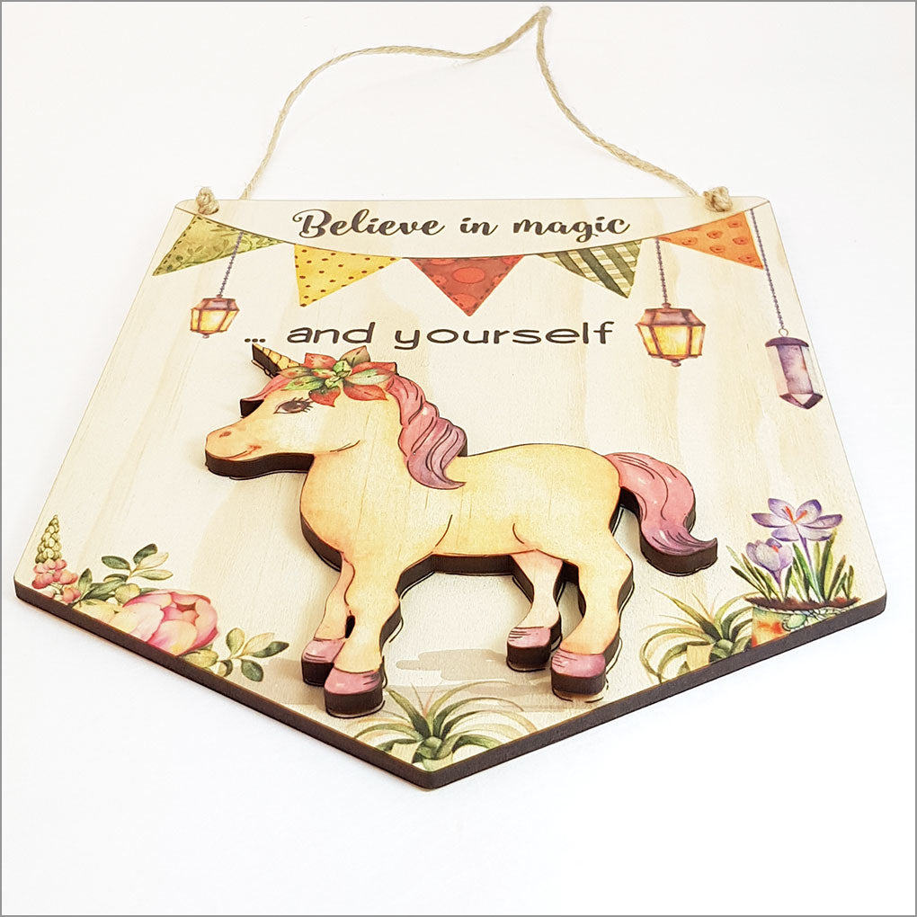 Inspiring wall art pine flag featuring 'Believe in Magic and Yourself', crafted from eco-friendly veneer, ready to hang.