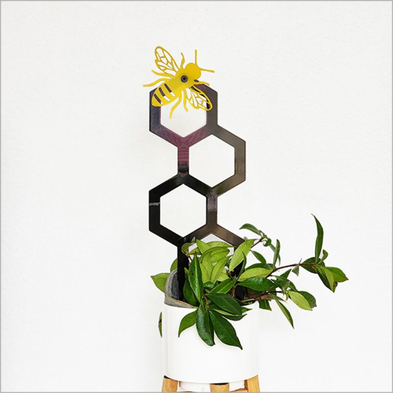30cm honeycomb plant trellis with a 3D laser-cut bee, supports vines and serves as stylish indoor/outdoor art piece.