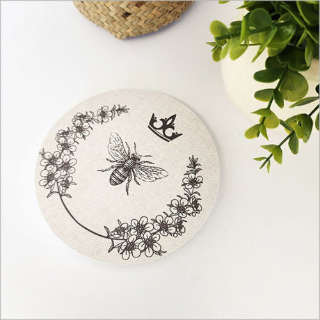 Canvas circle wall art featuring a Manuka bee design, 15cm diameter, perfect for nature-inspired home decor.