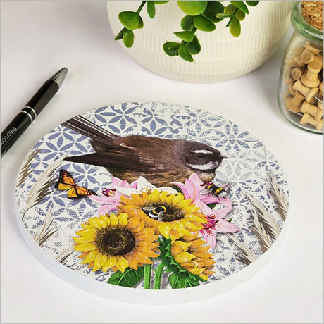 Circular canvas wall art featuring a colorful NZ fantail bird, perfect for adding a natural touch to any room.