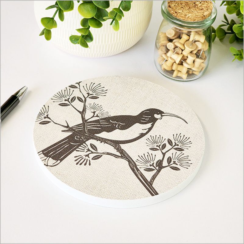 Canvas wall art featuring a Huia bird on a vibrant Pohutukawa tree, 15cm diameter, ready to hang.