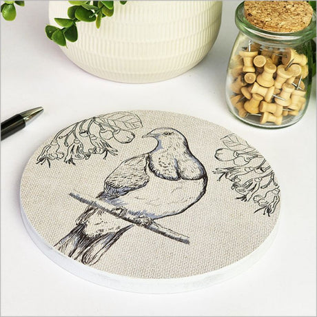 Canvas circle wall art featuring a Kereru perched on a vibrant Puriri tree, perfect for nature-inspired decor.