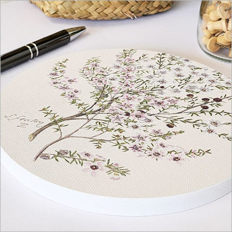 Circular canvas wall art featuring a vibrant Manuka flower design, 15cm diameter, perfect for any wall decor.