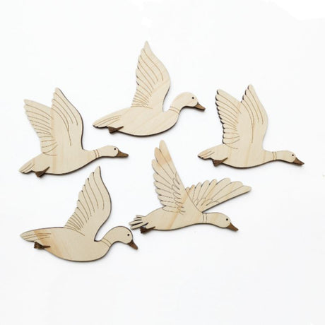 Intricate laser-cut pine ducks wall art, perfect for adding natural elegance to any room.