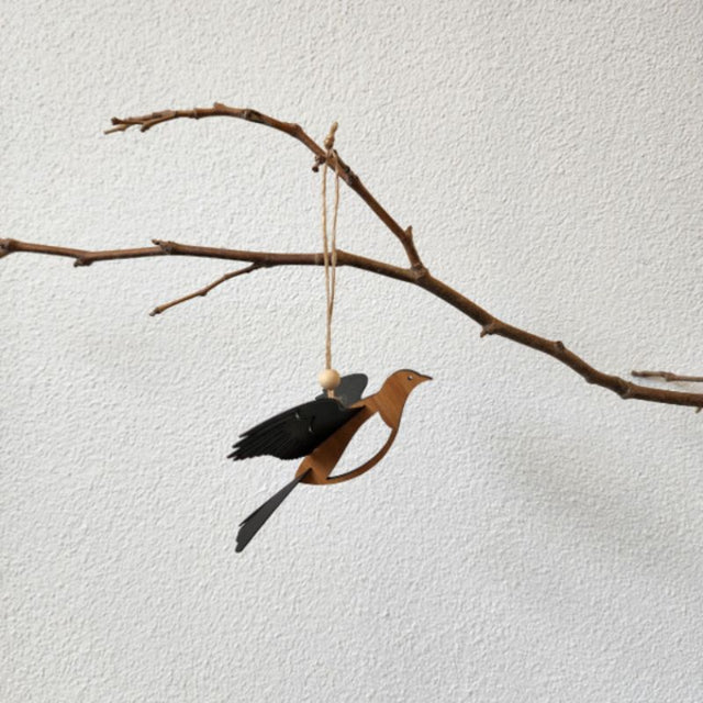 11.2cm Rimu Kereru hanging ornament showcasing intricate laser-cut details and 3D polypropylene wings, inspired by New Zealand wildlife.