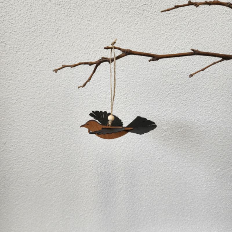 Beautifully crafted Rimu Tui ornament with 3D wings, perfect for festive or year-round home decor, ready to hang.