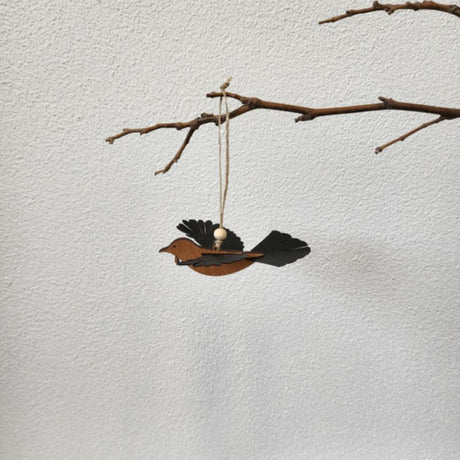 Beautifully crafted Rimu Tui ornament with 3D wings, perfect for festive or year-round home decor, ready to hang.