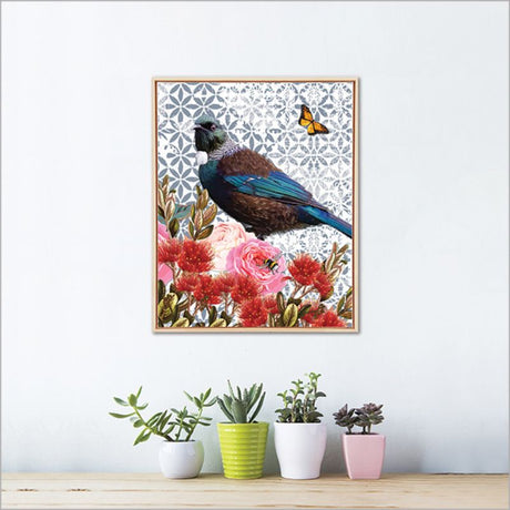 Framed canvas wall art featuring a vibrant floral tui bird design, eco-friendly ink, ready to hang, 425mm x 525mm.