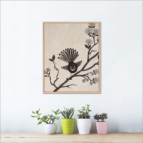 Framed canvas art featuring a vibrant Fantail bird, measuring 52.5cm, perfect for enhancing any home decor.