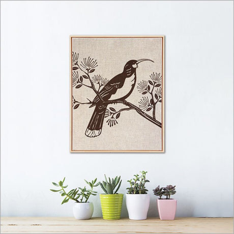 Framed canvas wall art featuring a vibrant Huia bird, eco-friendly printed, sized 52.5cm for nature-inspired decor.