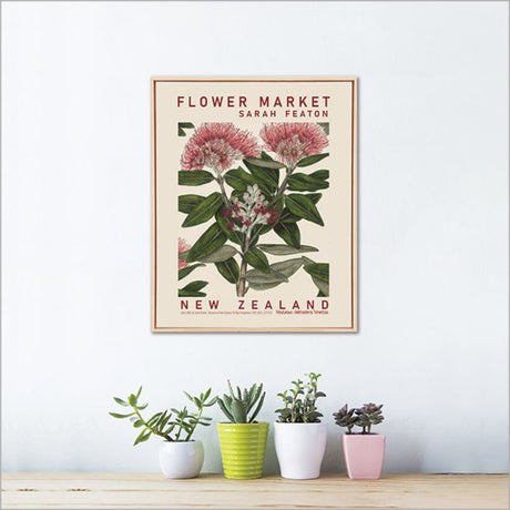 Framed canvas wall art featuring vibrant Pohutukawa blossoms by Sarah Featon, perfect for enhancing home decor.