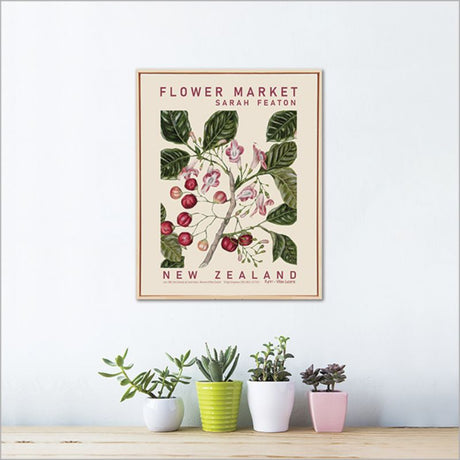 Framed canvas wall art featuring Sarah Featon's watercolor Puriri branch with bright red fruits and dark green leaves.