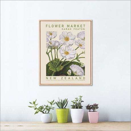 Framed canvas print of Sarah Featon's Mountain Lily, showcasing vibrant watercolor florals in eco-friendly ink.