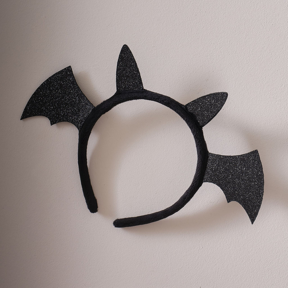 Black Sparkle Bat Headband with glitter wings, ideal for Halloween costumes and imaginative play, eco-friendly packaging.