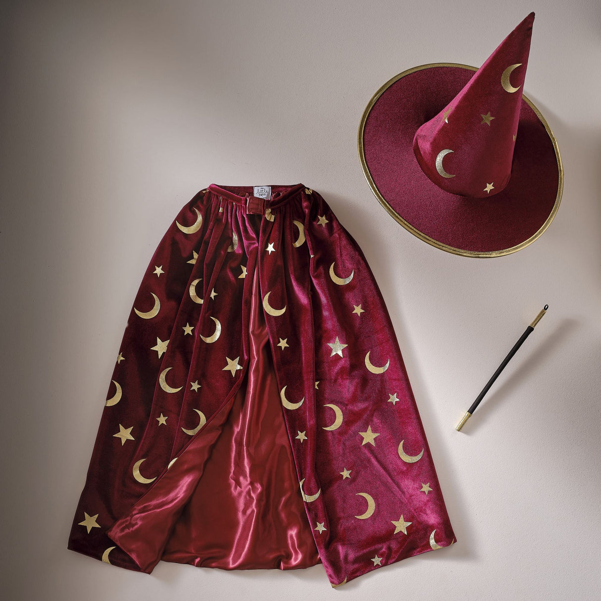 Burgundy velvet magician hat with gold stars and moons, perfect for imaginative play and costume events.