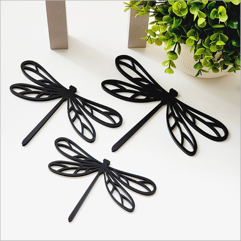 Acrylic wall art set featuring three black dragonflies in varying sizes, perfect for modern interior decor.