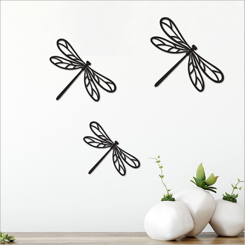 Acrylic wall art set featuring three matte black dragonflies, perfect for modern and minimalist home decor.