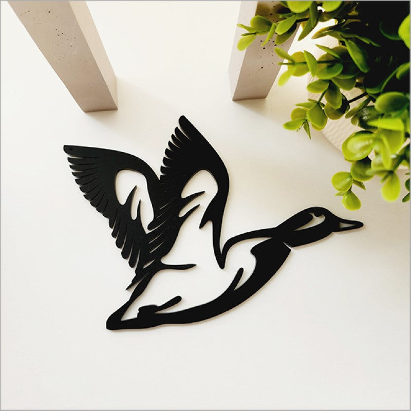 Acrylic wall art featuring a minimalist black flying duck design, perfect for modern home decor.
