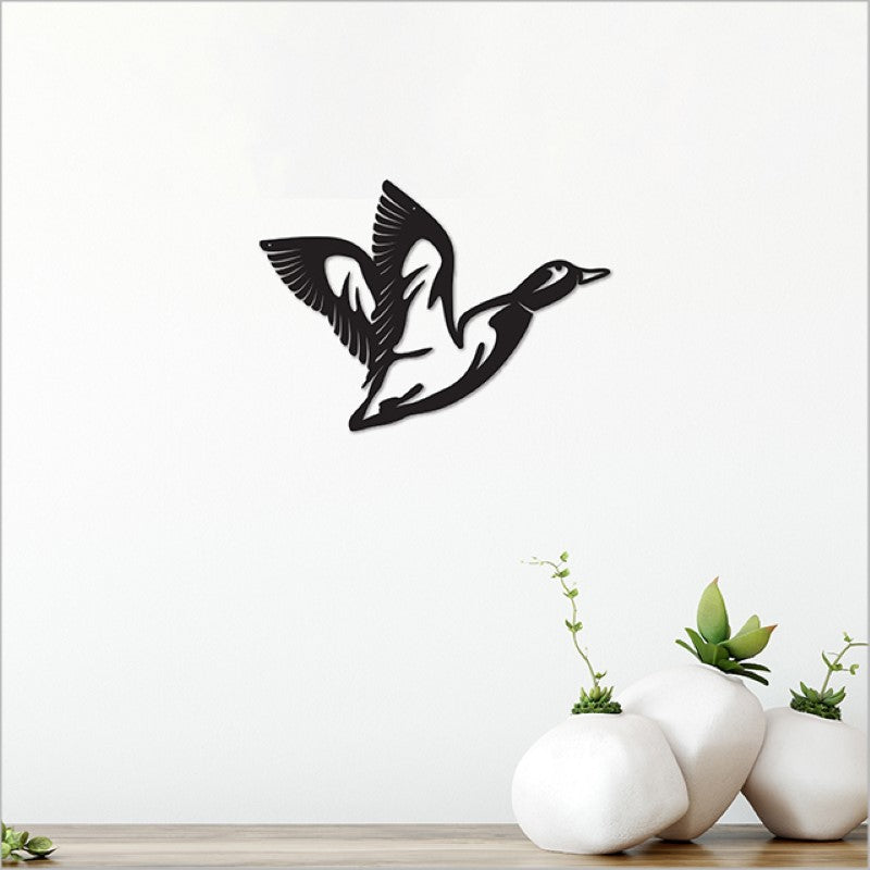 Acrylic wall art featuring a sleek black flying duck, perfect for modern home decor, measuring 22cm.