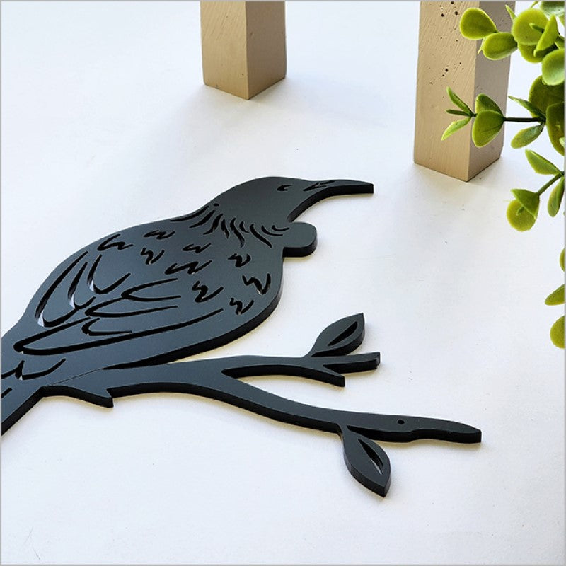 Black acrylic tui wall art in matte finish, 104mm x 116mm, ideal for modern home decor and easy to mount.