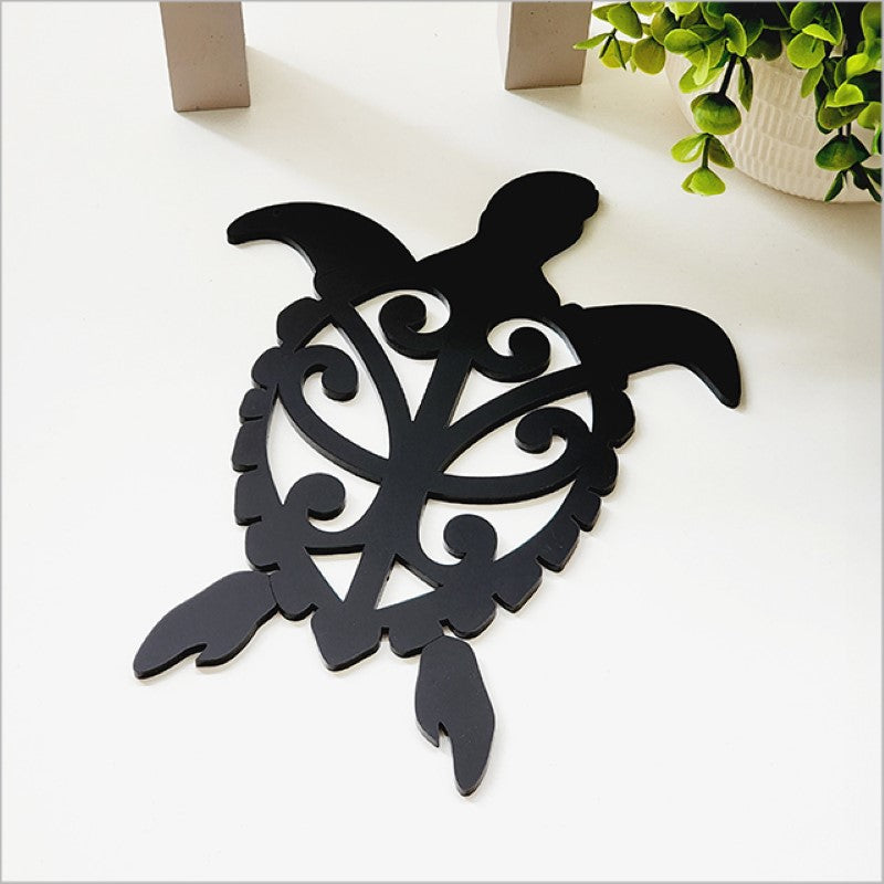 Acrylic wall art featuring a black Honu turtle, perfect for enhancing coastal-themed home decor.