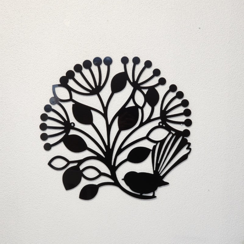 Large black wall art featuring a fantail and pohutukawa tree design, perfect for indoor or outdoor decor.