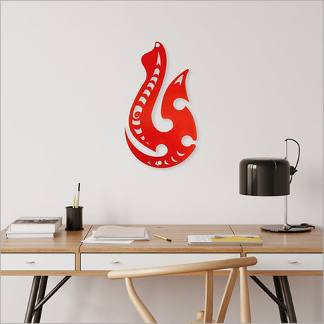 Large red satin acrylic wall art featuring a Hei Matau symbolizing strength and safe travels, ideal for Kiwiana decor.