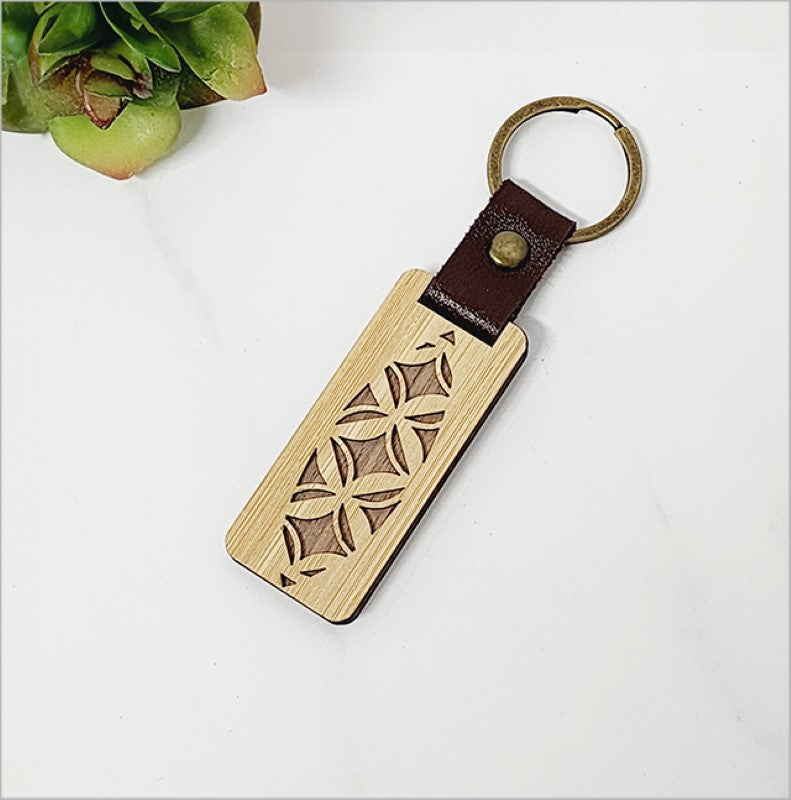 Eco-friendly bamboo veneer keyring Tapa, lightweight and stylish, infused with Kiwiana charm for everyday use.