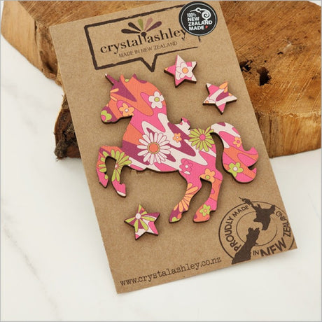 Whimsical unicorn wall art set in retro pink floral design, perfect for adding charm to a child's room.