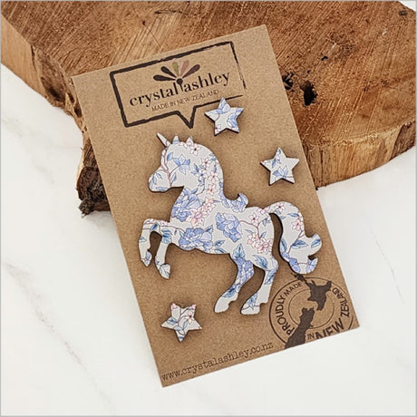 Charming unicorn wall art set in vintage floral blue, perfect for nursery decor, crafted from textured MDF.