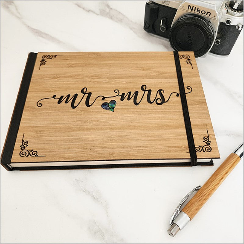 Elegant bamboo guest book for weddings, featuring NZ Paua and 128 acid-free pages for cherished memories.