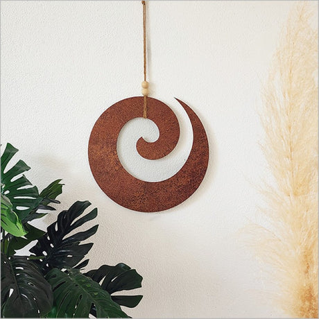 Rusted copper textured wall art featuring a Koru design, symbolizing growth; perfect for indoor or covered outdoor spaces.