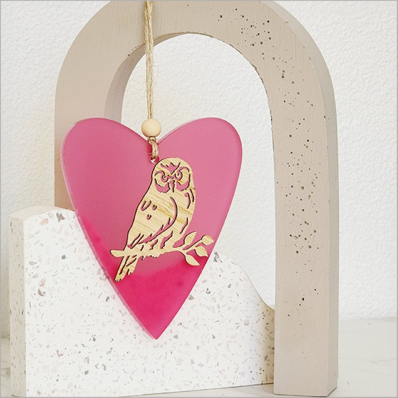 Pink satin heart ornament with intricate bamboo design, lightweight and ready to hang for elegant home decor.