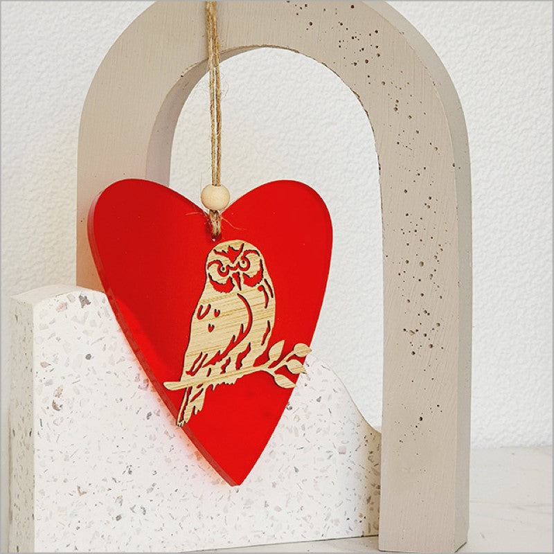 Heart-shaped hanging ornament in red satin acrylic, crafted from bamboo, perfect for holiday decor or gifting.