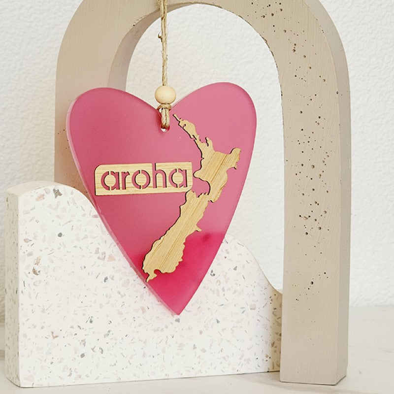 Pink satin acrylic heart ornament with laser-cut bamboo base, perfect for home decor or gifting.