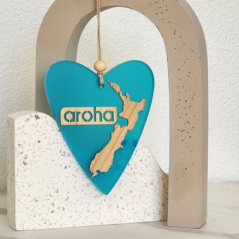 Teal satin acrylic heart-shaped ornament, elegantly designed for home decor, ready to hang, symbolizes love and connection.