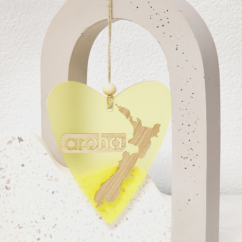 Yellow satin acrylic heart-shaped hanging ornament, featuring laser-cut bamboo, ideal for home decor and gifting.