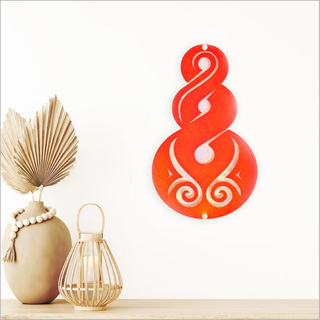 Large red satin acrylic Pikorua wall art symbolizing connection and life's journey, perfect for home or office decor.