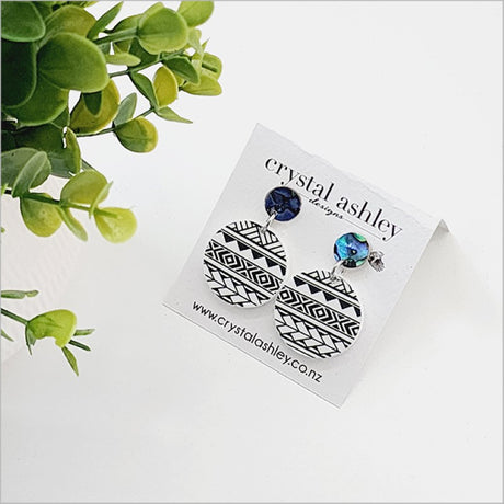 Elegant drop dangle earrings featuring round black Patiki and Paua, crafted for comfort and Kiwiana style.