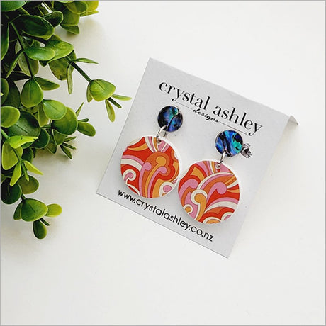 Kiwiana-inspired drop dangle earrings featuring vibrant Paua shell and round acrylic, perfect for casual or special occasions.