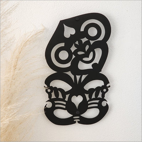 Large black satin acrylic Hei Tiki wall art, symbolizing luck and strength, perfect for home or office decor.
